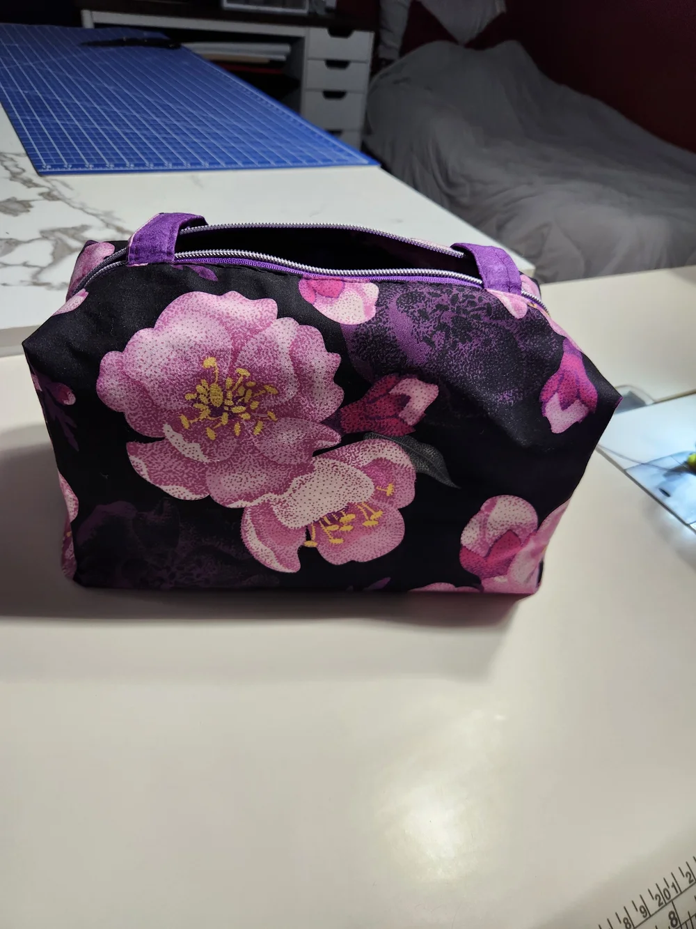 Purple Floral Cosmetic Bag with Black Background